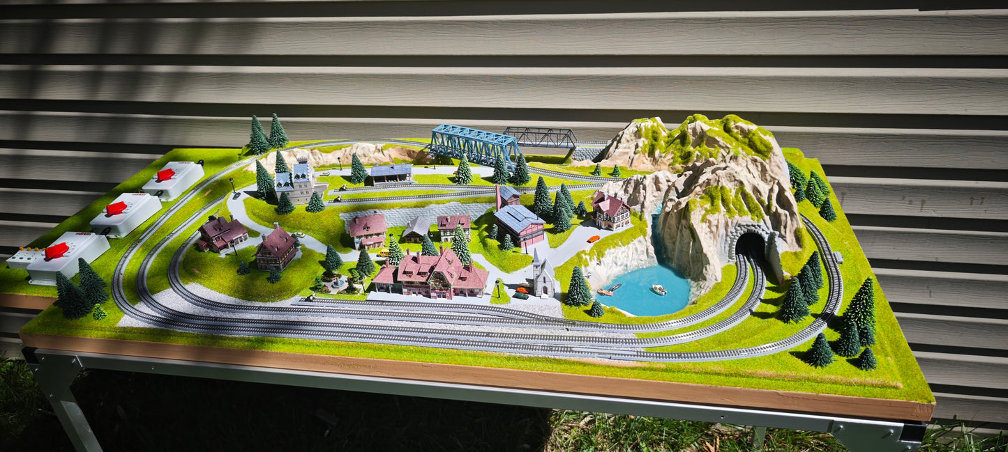 Noch Z Finished NOCH Traunstein Z Scale Layout. 3 Trains! Rokuhan Track, Marklin Conrollers, EMTZ Structures, Street/House Lights, The Works!  49" x 27"